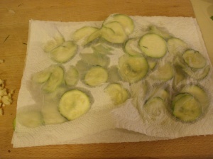 pressing the zucchini